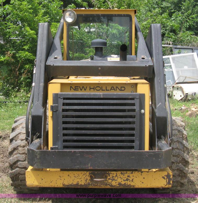 image for item 8002 New Holland L785 skid steer