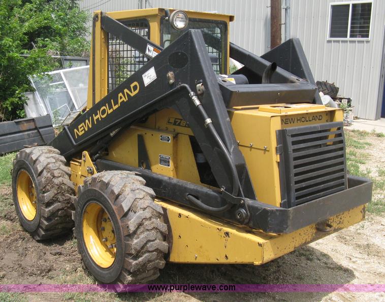image for item 8002 New Holland L785 skid steer