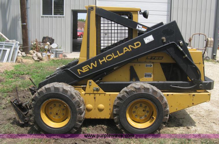 image for item 8002 New Holland L785 skid steer