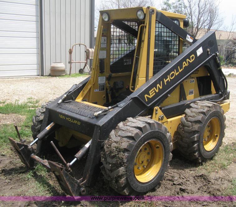 image for item 8002 New Holland L785 skid steer
