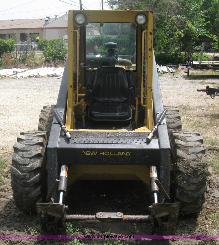 image for item 8002 New Holland L785 skid steer