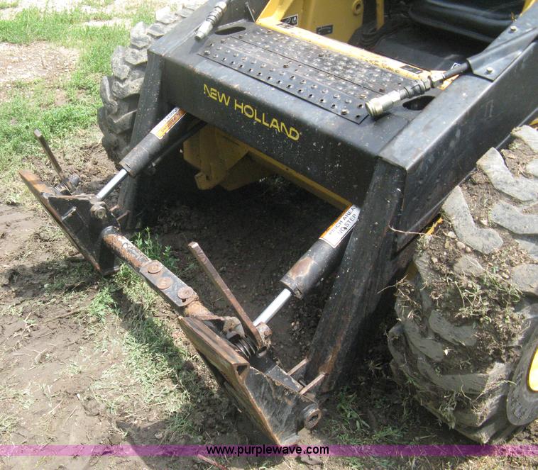 image for item 8002 New Holland L785 skid steer