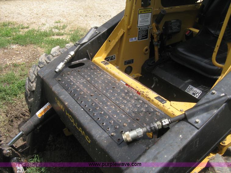 image for item 8002 New Holland L785 skid steer