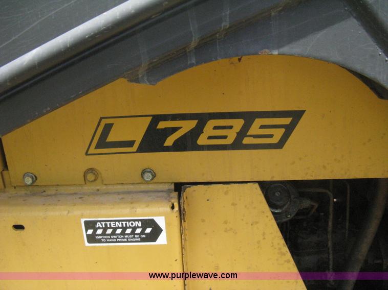 image for item 8002 New Holland L785 skid steer