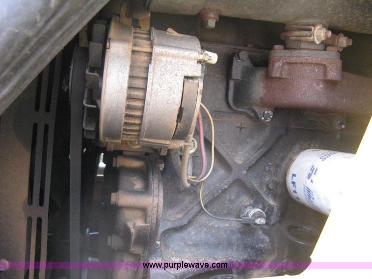 image for item 8002 New Holland L785 skid steer