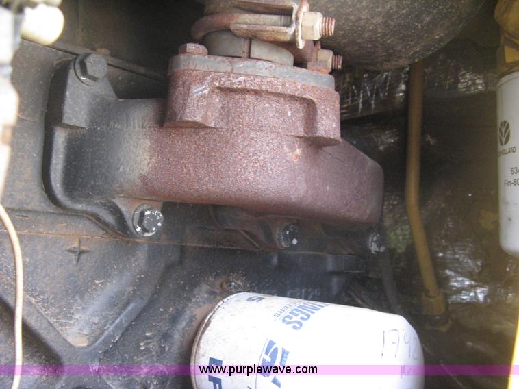 image for item 8002 New Holland L785 skid steer