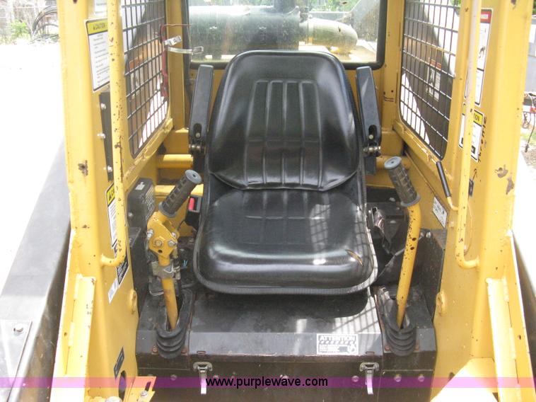 image for item 8002 New Holland L785 skid steer