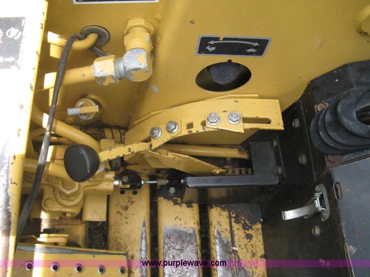 image for item 8002 New Holland L785 skid steer