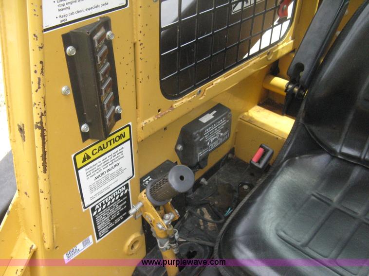 image for item 8002 New Holland L785 skid steer