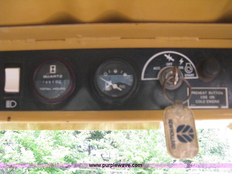 image for item 8002 New Holland L785 skid steer