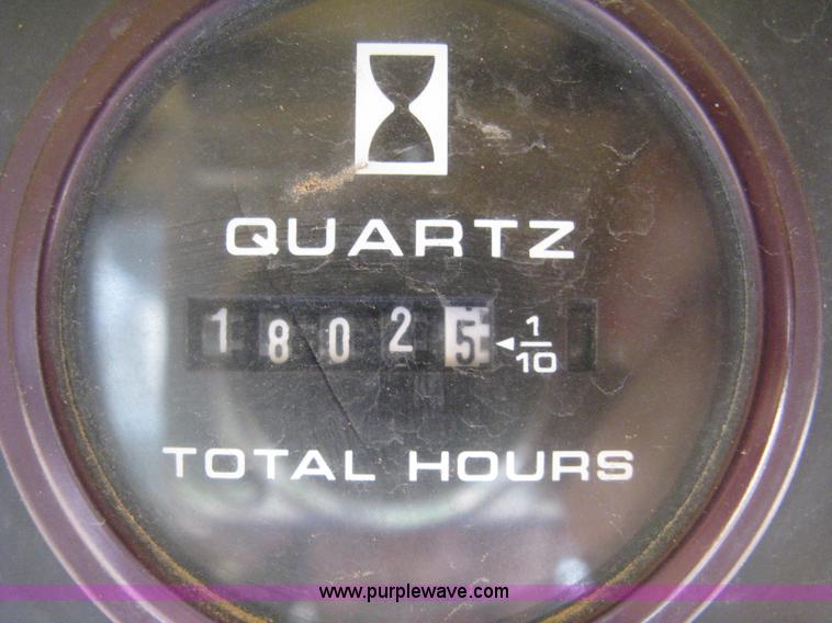 image for item 8002 New Holland L785 skid steer