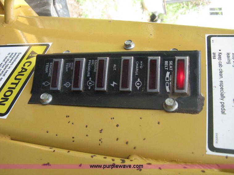 image for item 8002 New Holland L785 skid steer