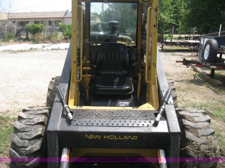 image for item 8002 New Holland L785 skid steer