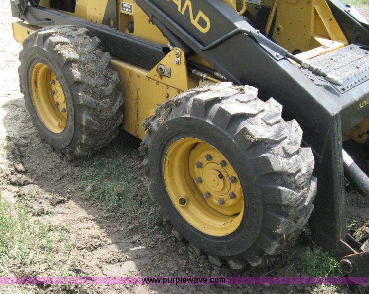 image for item 8002 New Holland L785 skid steer