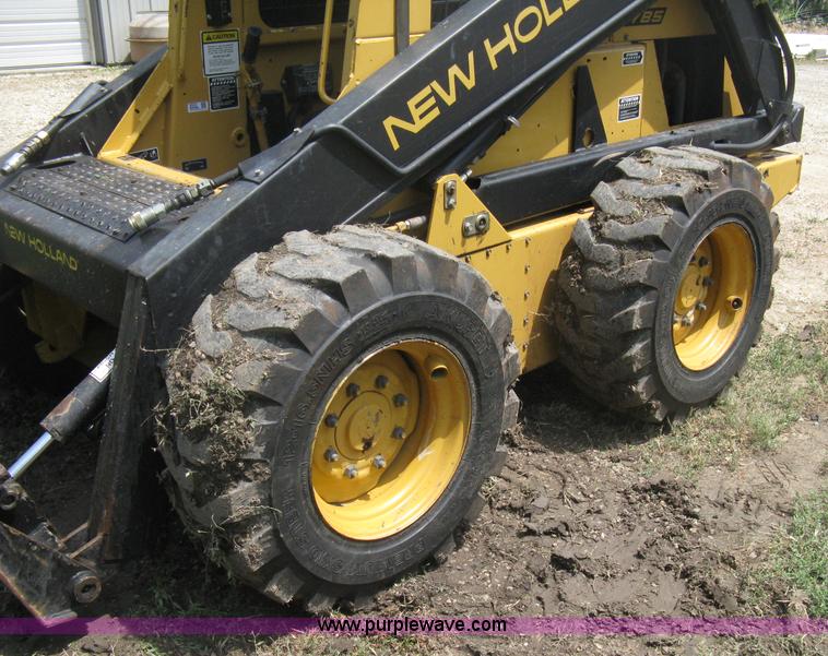 image for item 8002 New Holland L785 skid steer