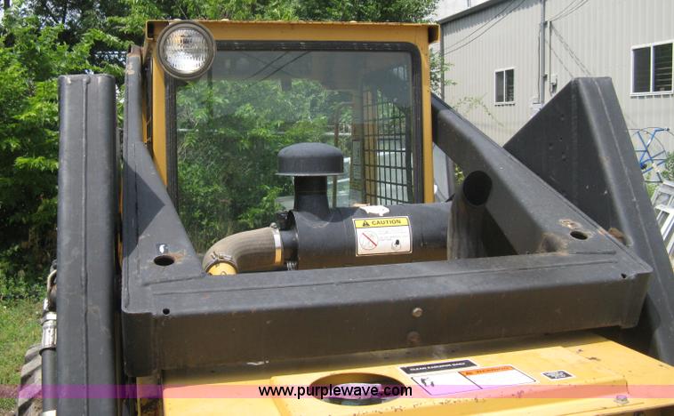 image for item 8002 New Holland L785 skid steer