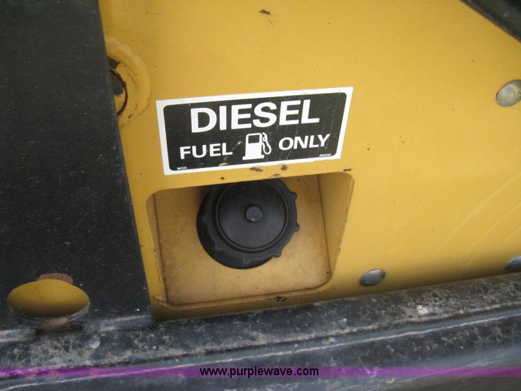 image for item 8002 New Holland L785 skid steer