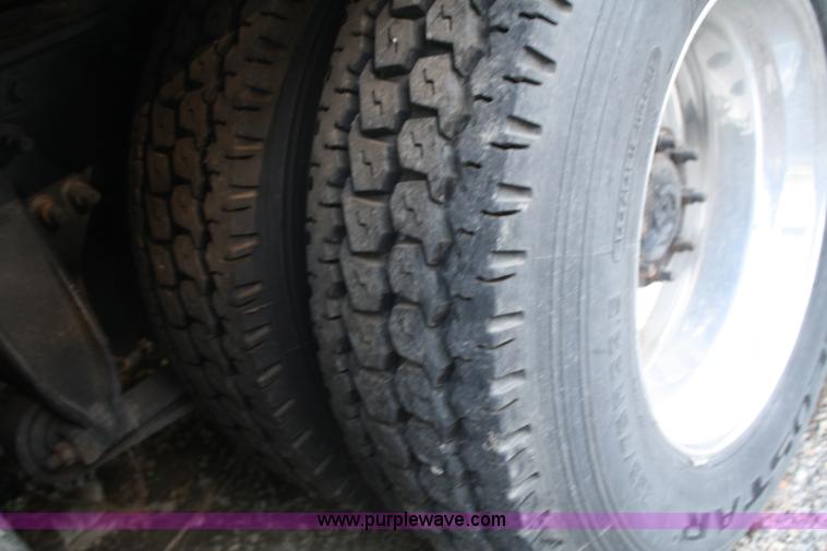 image for item A2050 1999 Freightliner FLC120 semi truck