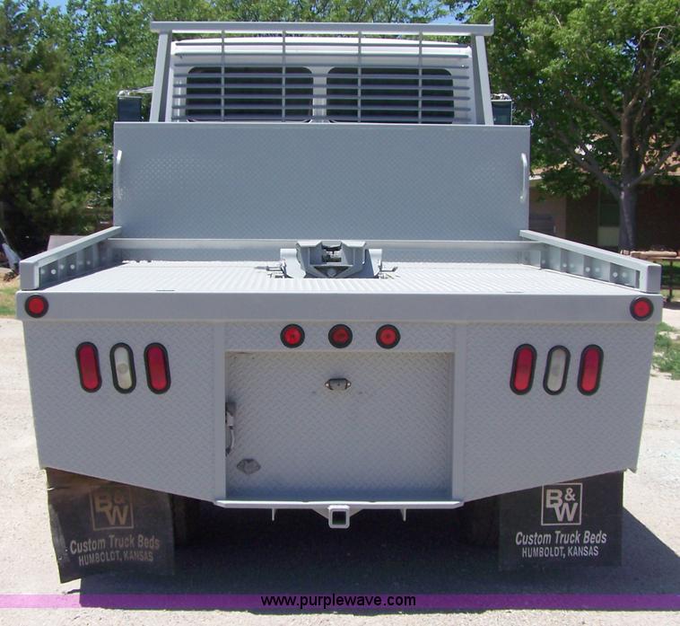 image for item 7398 2000 Freightliner FL70 flatbed semi truck