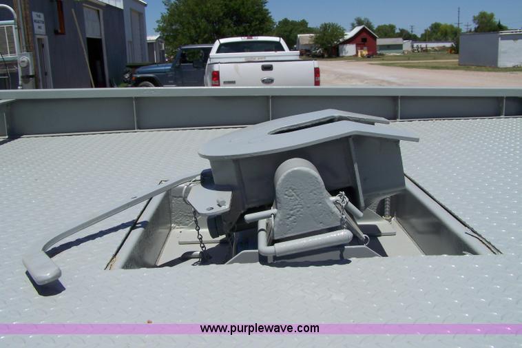 image for item 7398 2000 Freightliner FL70 flatbed semi truck