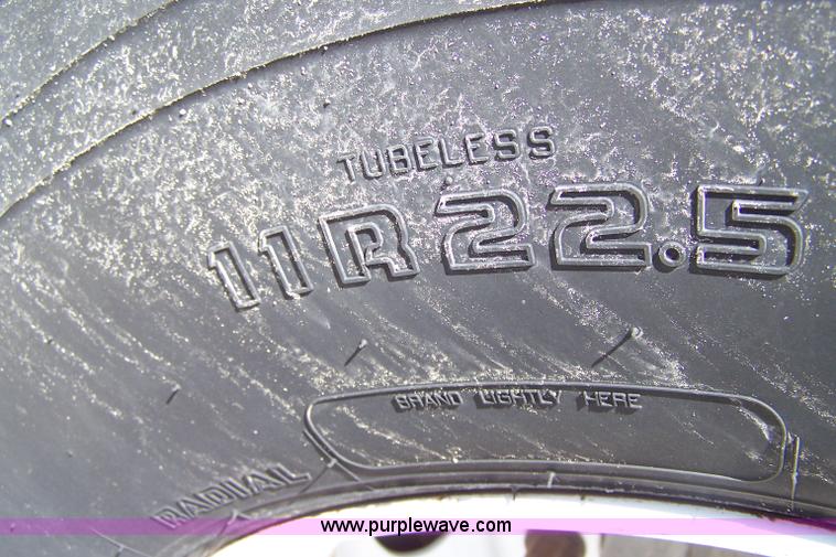 image for item 7398 2000 Freightliner FL70 flatbed semi truck