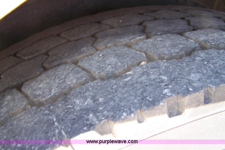 image for item 7398 2000 Freightliner FL70 flatbed semi truck