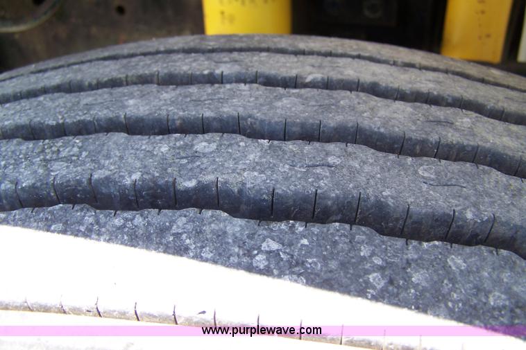 image for item 7398 2000 Freightliner FL70 flatbed semi truck