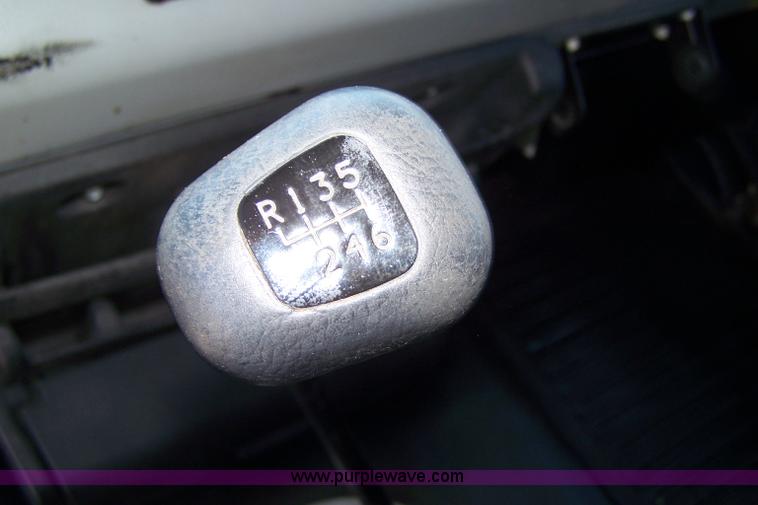 image for item 7398 2000 Freightliner FL70 flatbed semi truck