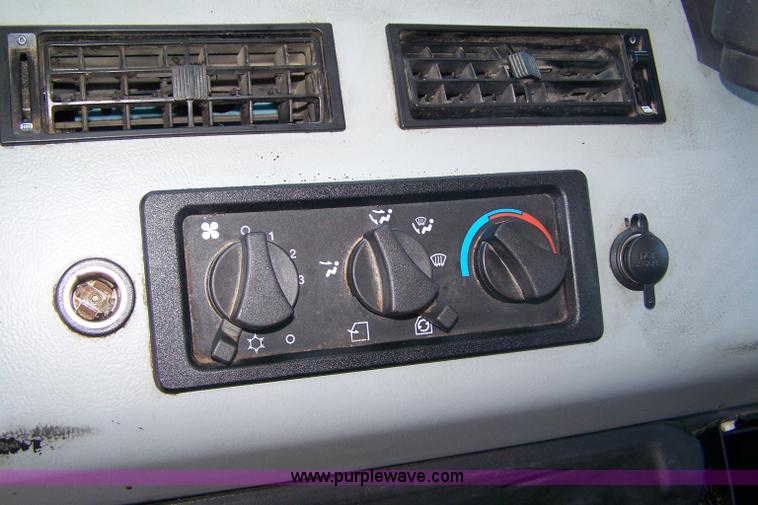 image for item 7398 2000 Freightliner FL70 flatbed semi truck