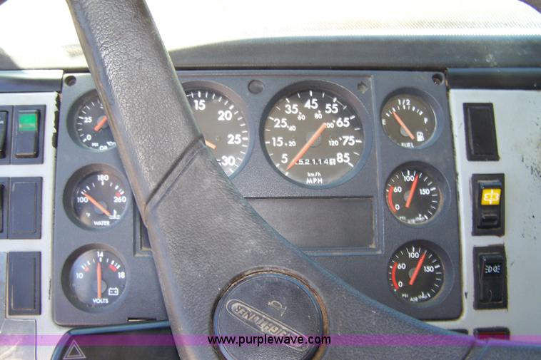 image for item 7398 2000 Freightliner FL70 flatbed semi truck