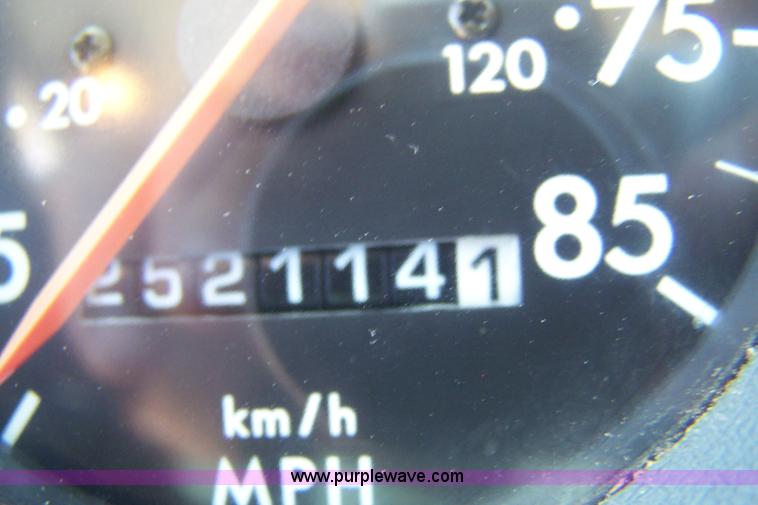 image for item 7398 2000 Freightliner FL70 flatbed semi truck