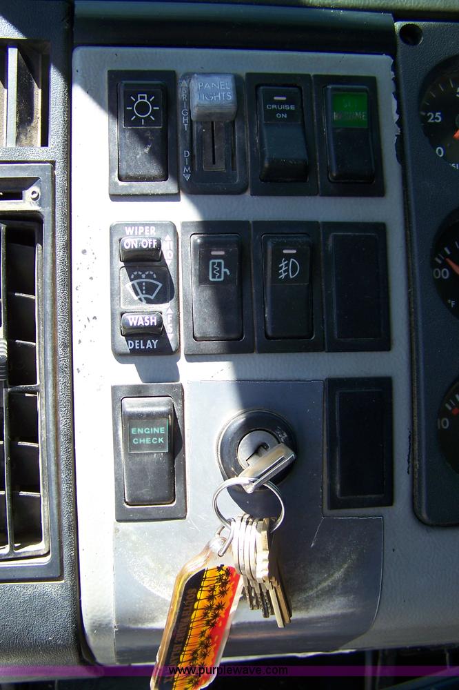 image for item 7398 2000 Freightliner FL70 flatbed semi truck