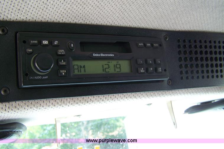 image for item 7398 2000 Freightliner FL70 flatbed semi truck