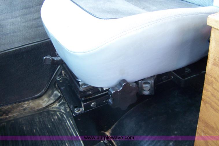 image for item 7398 2000 Freightliner FL70 flatbed semi truck