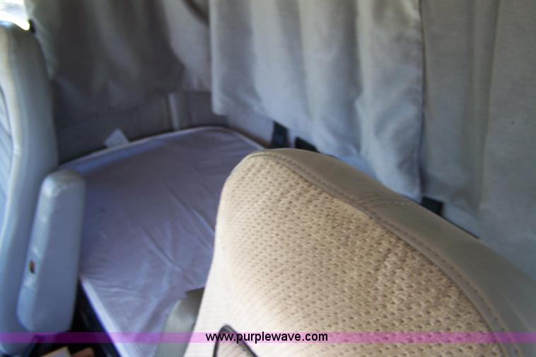 image for item 7398 2000 Freightliner FL70 flatbed semi truck