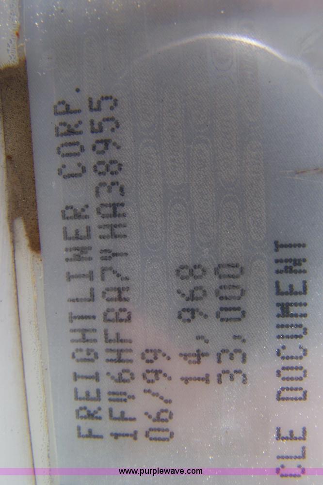 image for item 7398 2000 Freightliner FL70 flatbed semi truck