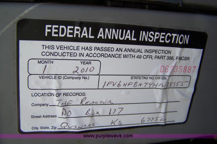 image for item 7398 2000 Freightliner FL70 flatbed semi truck