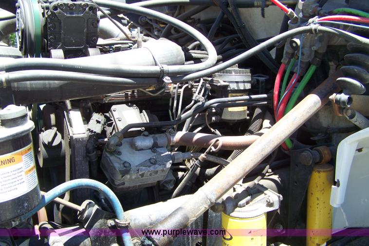 image for item 7398 2000 Freightliner FL70 flatbed semi truck