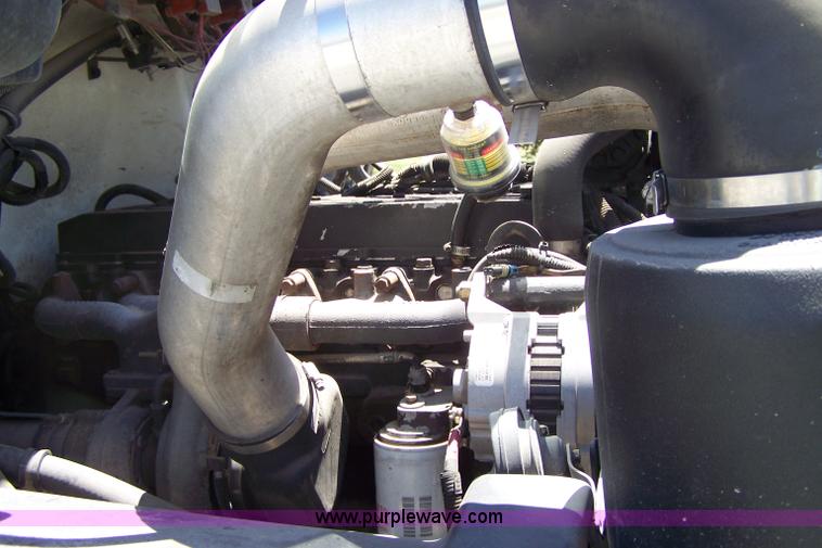 image for item 7398 2000 Freightliner FL70 flatbed semi truck