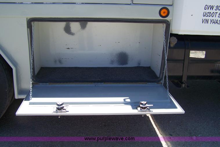 image for item 7398 2000 Freightliner FL70 flatbed semi truck