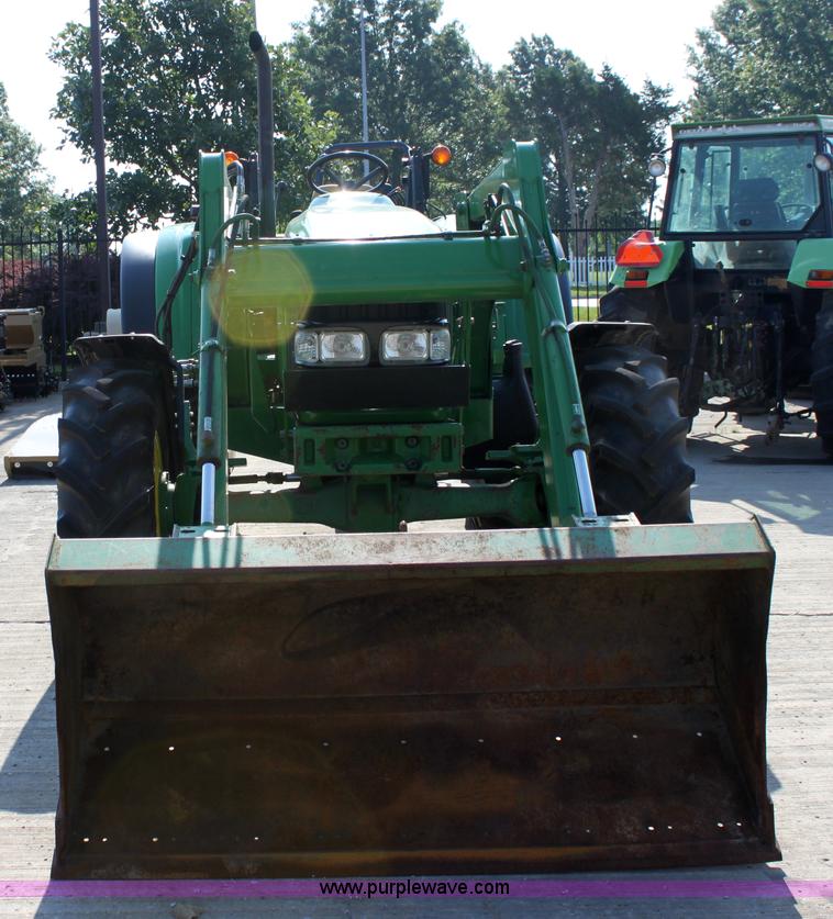 image for item A2009 2005 John Deere 6420 MFWD tractor with loader