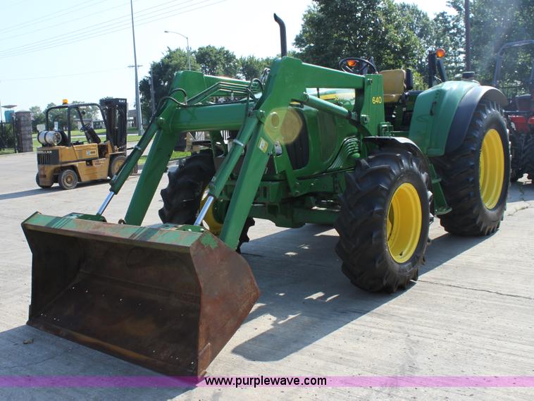 image for item A2009 2005 John Deere 6420 MFWD tractor with loader