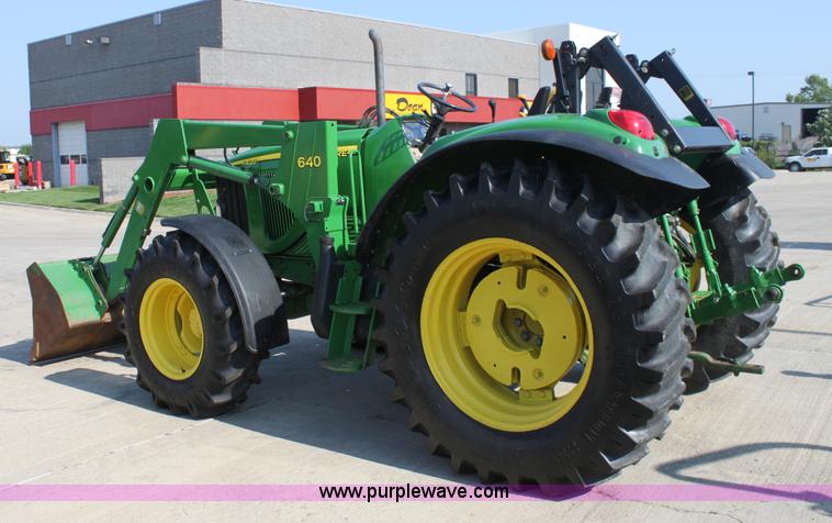 image for item A2009 2005 John Deere 6420 MFWD tractor with loader
