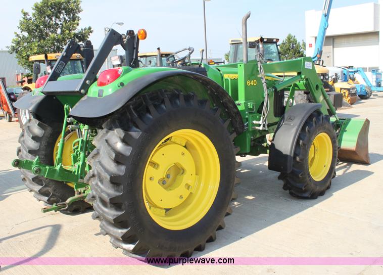 image for item A2009 2005 John Deere 6420 MFWD tractor with loader
