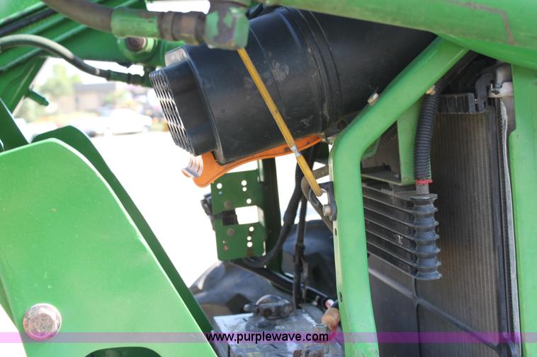 image for item A2009 2005 John Deere 6420 MFWD tractor with loader