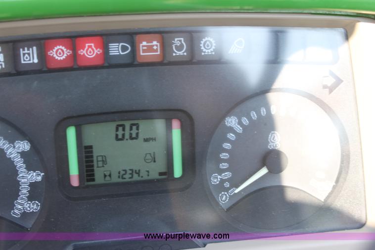 image for item A2009 2005 John Deere 6420 MFWD tractor with loader