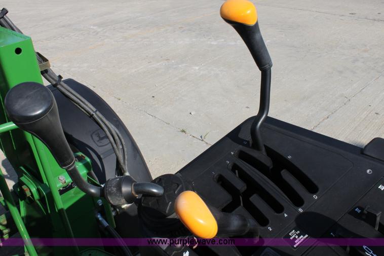 image for item A2009 2005 John Deere 6420 MFWD tractor with loader