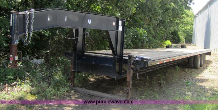 image for item A4797 2006 Progressive flatbed goose neck trailer