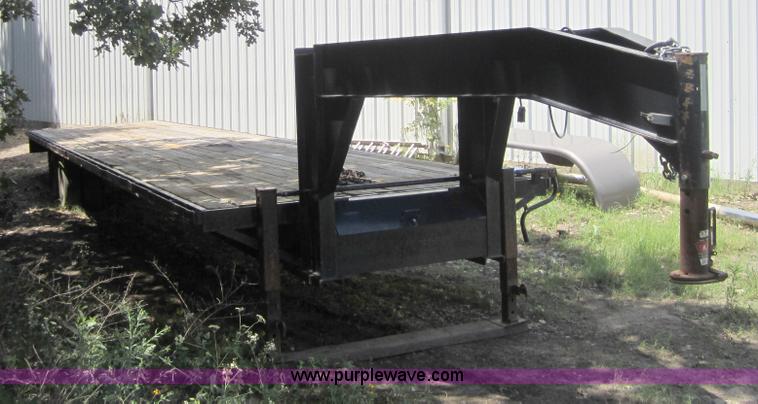 image for item A4797 2006 Progressive flatbed goose neck trailer
