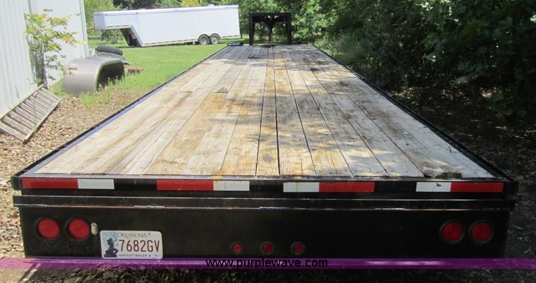 image for item A4797 2006 Progressive flatbed goose neck trailer